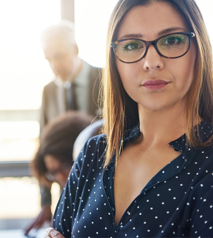 serious-business-woman-in-front-of-team-S8KCP9H7